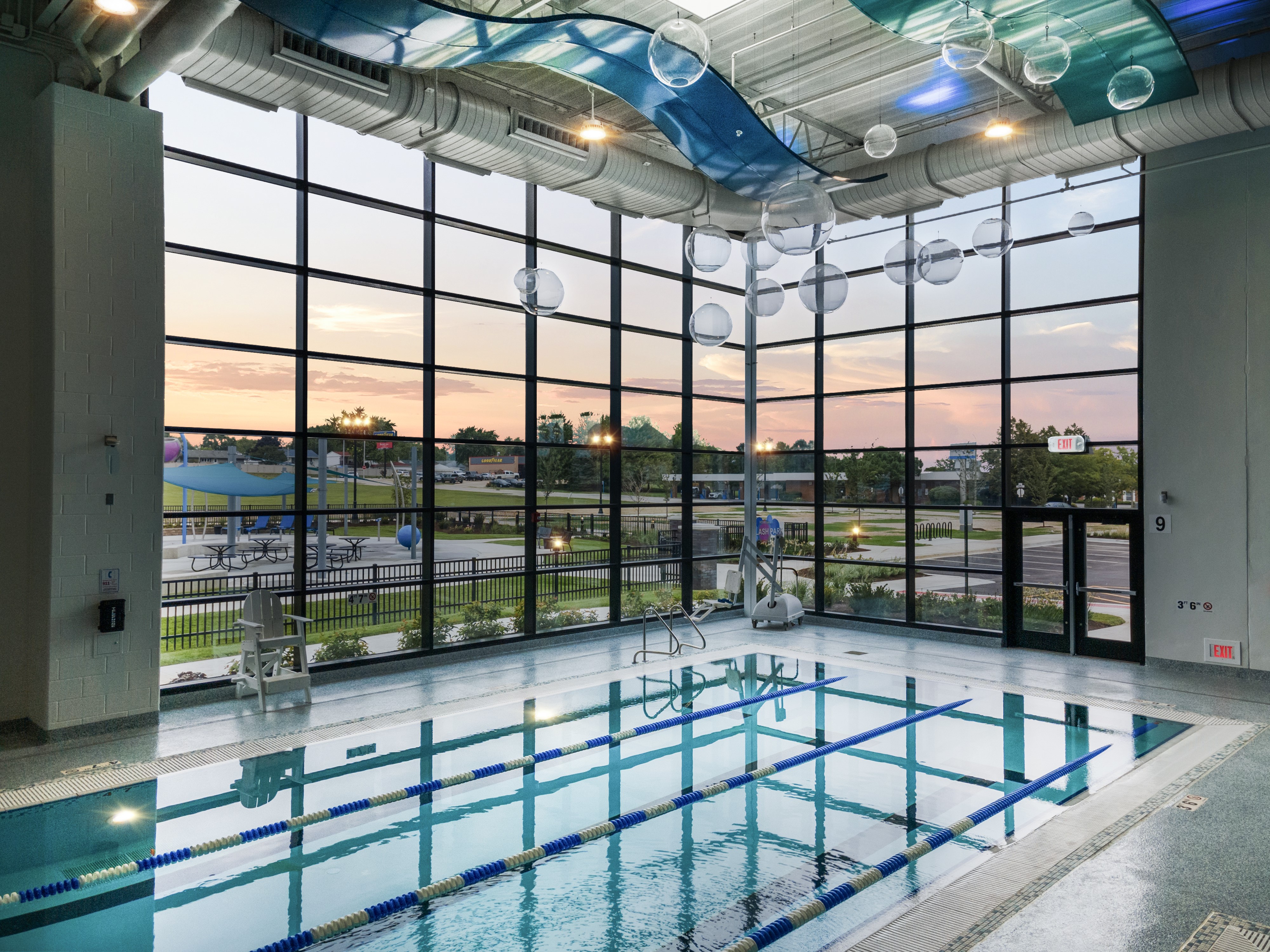 Bright indoor children's pool with water slides and splash play features